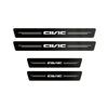 Three black carbon fiber door sill protector stickers for select Honda models