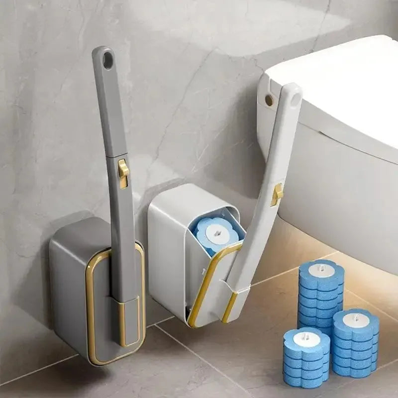 A gray disposable toilet brush set with an automatic lid and replacement heads resting on a tiled floor.