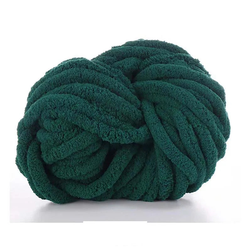 A ball of dark green chunky chenille yarn used for knitting and crochet