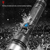 A silver and black high-power rechargeable LED flashlight is shown being used in a wet, outdoor environment.