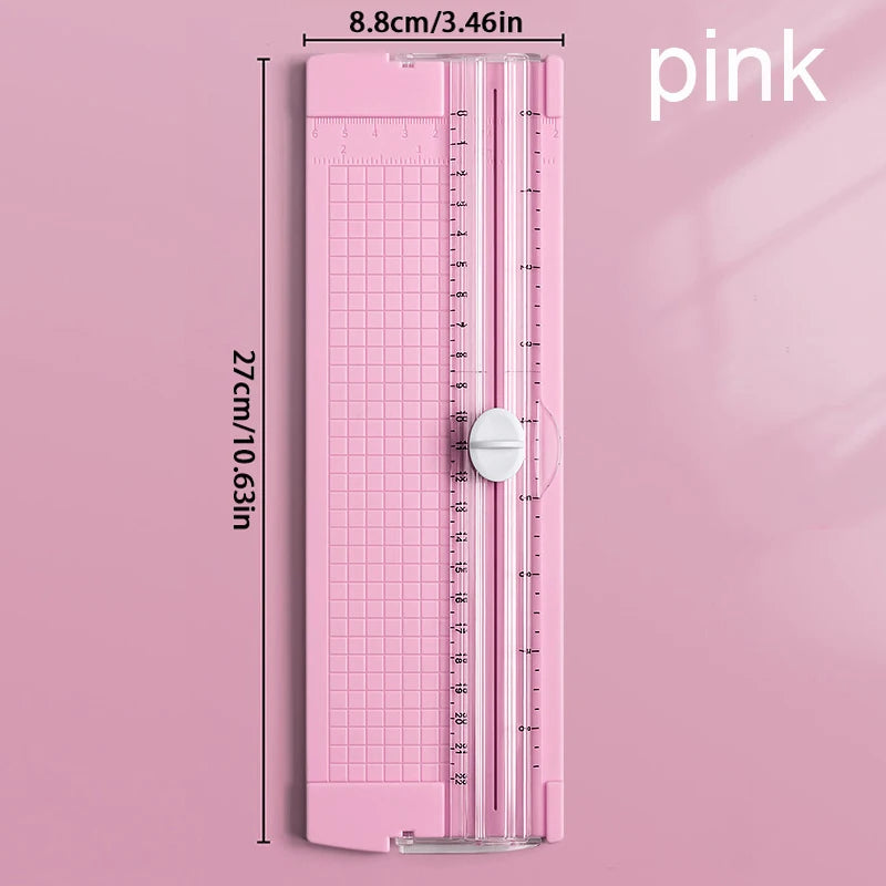 Pink A4 mini paper trimmer with precision cutter showing measurement markings and a pink color scheme