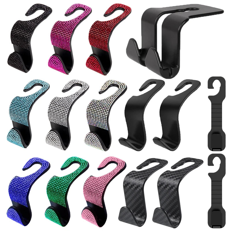 A collection of black and colored car headrest hooks for storage, including various sizes and finishes.