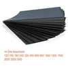 A stack of 14 assorted grits of sandpaper, ranging from 120 to 3000 grit.