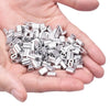 A hand holds a pile of silver aluminum double barrel crimp sleeves for wire rope.