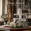 A detailed miniature model of a white Victorian house with multiple stories and architectural features.