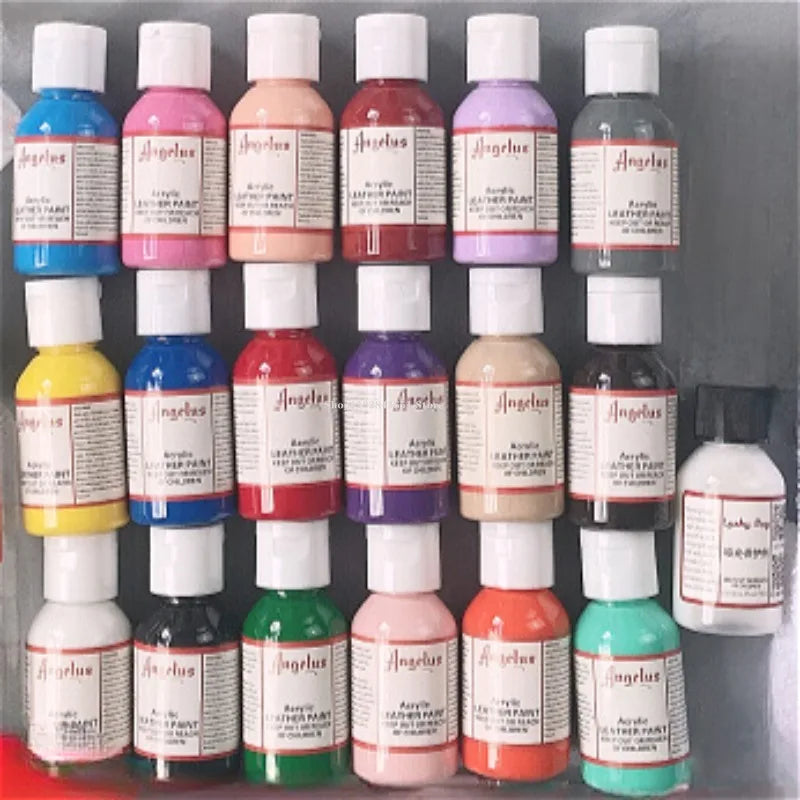 A collection of glass bottles containing various colors of leather pigment dye for shoes, bags, and DIY art projects.