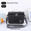 Black insulated lunch bag with a gray shoulder strap shown on a white surface.