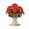 A bouquet of red roses and pink cherry blossoms arranged in a decorative card display.