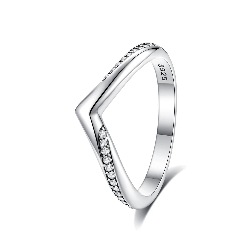 A close-up view of a sterling silver heart ring set with cubic zirconia stones.