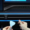 Hands are inserting a small blue plastic piece into a gap in a car interior panel for an RGB music-sync LED light strip.