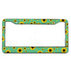 A rectangular aluminum license plate frame with a green background and yellow sunflower pattern.