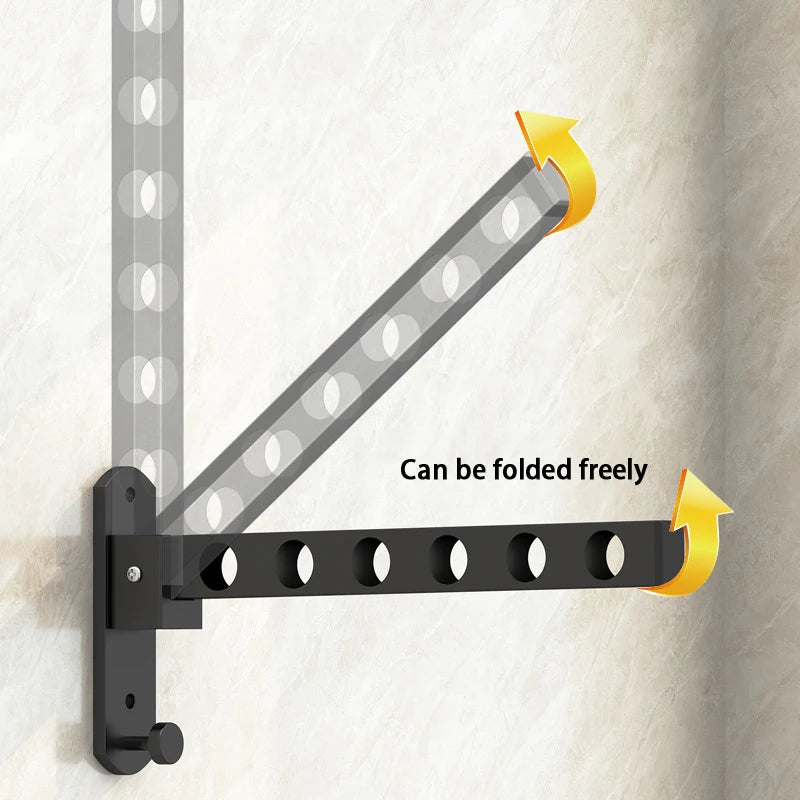 A black foldable wall-mounted clothes drying rack is shown mounted on a wall, demonstrating its flexible design.