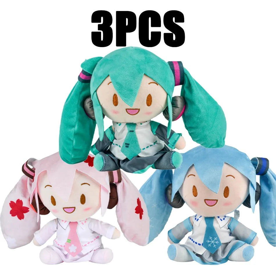 Three plush dolls of Hatsune Miku anime figures in various colors including teal pink and blue