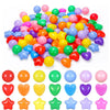 A large pile of colorful non-toxic ball pit balls for kids in various bright colors.