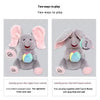 Two ways to play elephant plush toy showing gentle foot press and hand switch options