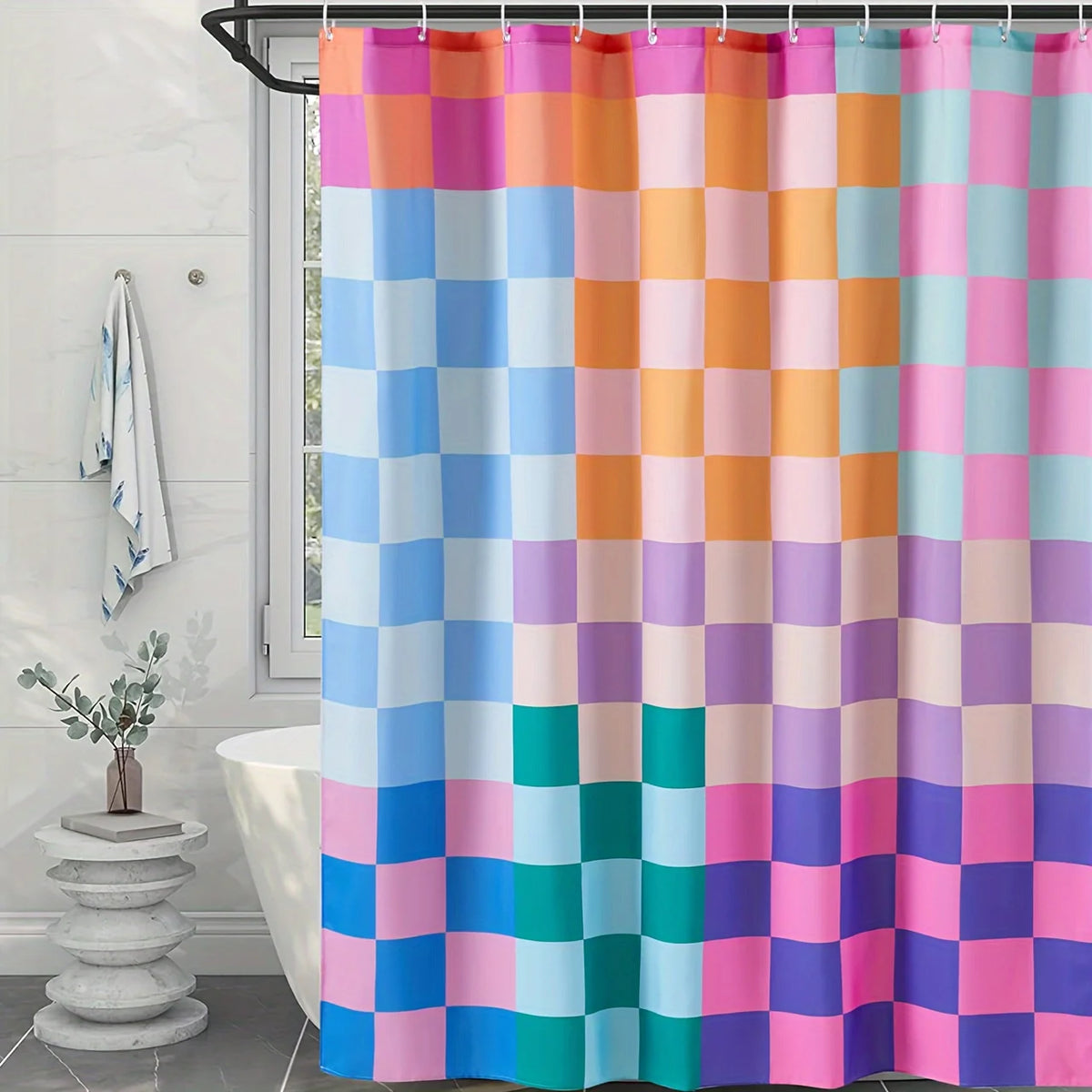 A shower curtain featuring a bright rainbow plaid pattern with squares of various pastel colors.