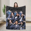 A large black canvas print featuring a group of women with the name Katseye above them.