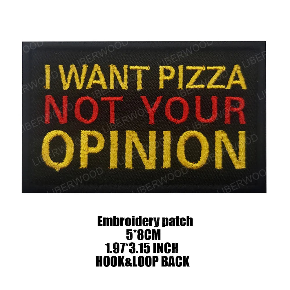 Black embroidered patch with yellow and red text that reads I WANT PIZZA NOT YOUR OPINION