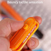 An orange magnetic bouncing play toy is held in a hand, demonstrating bouncy tactile sensation.