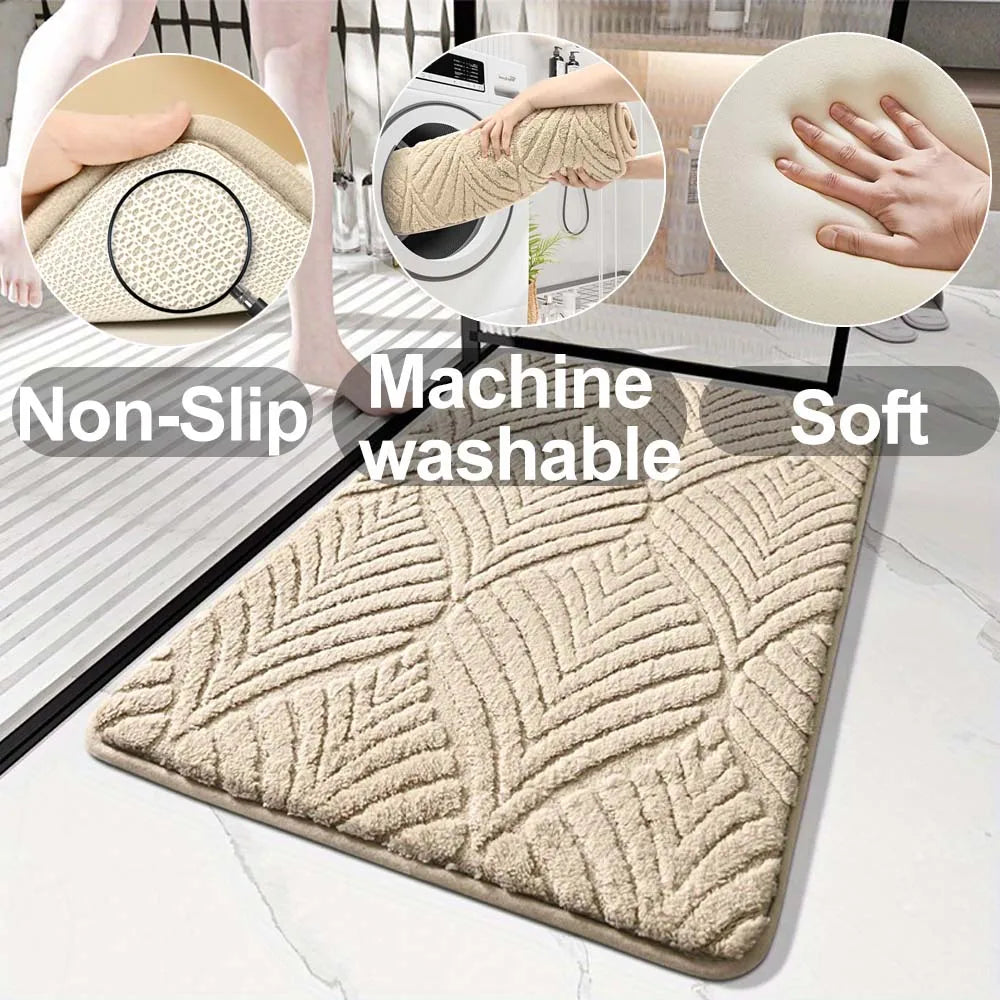 A beige plush velvet bathroom mat with a textured pattern and non-slip backing shown on a floor.