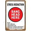 A vintage metal tin sign with text reading STRESS REDUCTION and BANG HEAD HERE on a red circle.