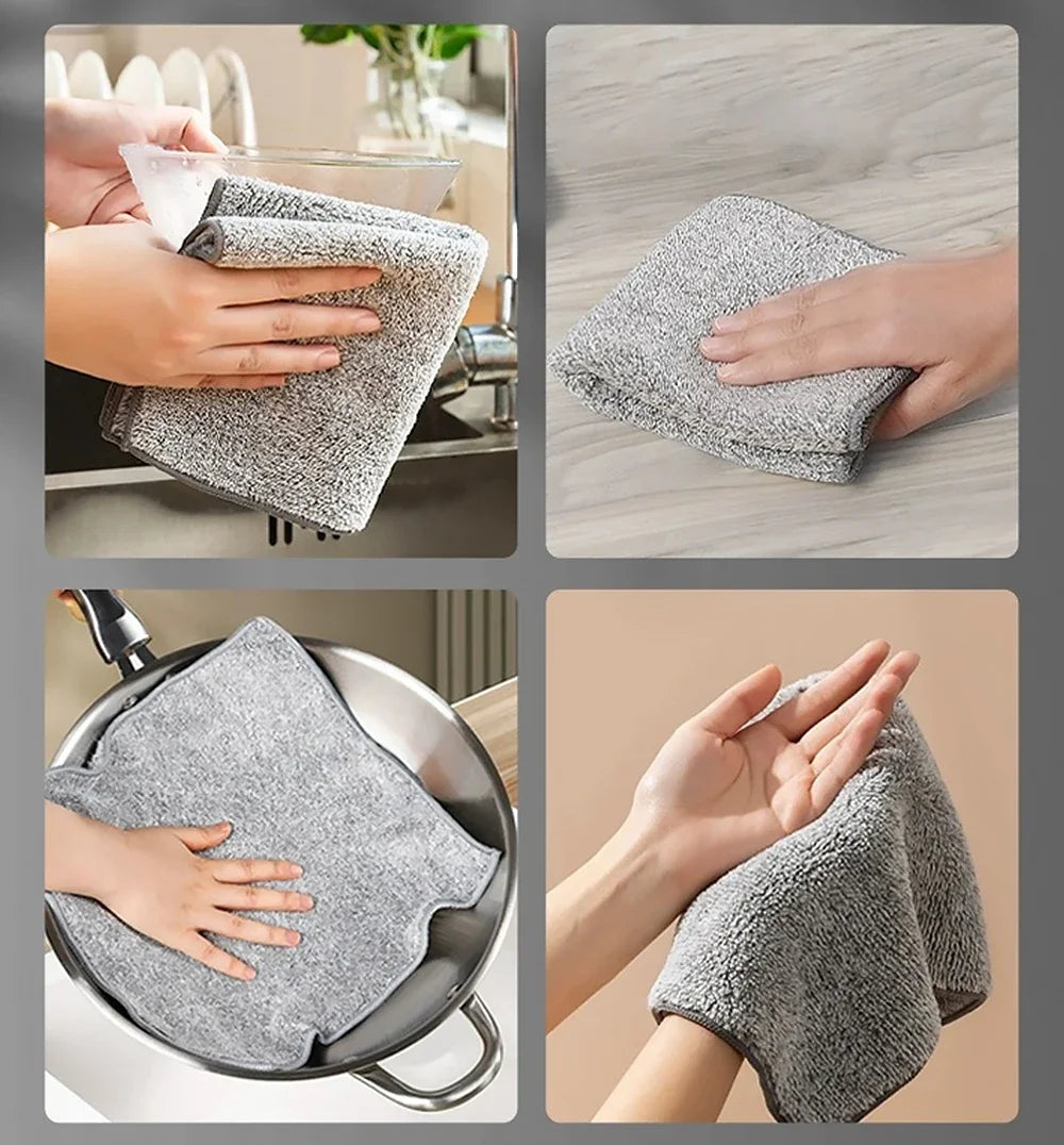 Hands are cleaning a stainless steel sink and a frying pan with gray bamboo charcoal microfiber kitchen cleaning cloths.