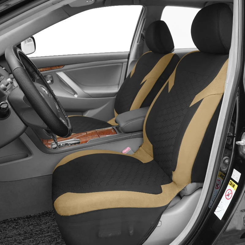Car seat covers featuring a honeycomb mesh pattern on a black fabric with tan accents.