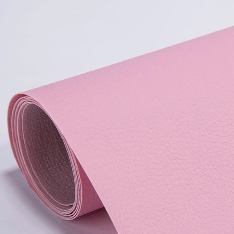 Roll of pink self-adhesive PU leather repair patches, showing the texture and roll.