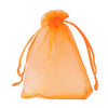 A clear orange organza drawstring gift bag is shown against a white background.