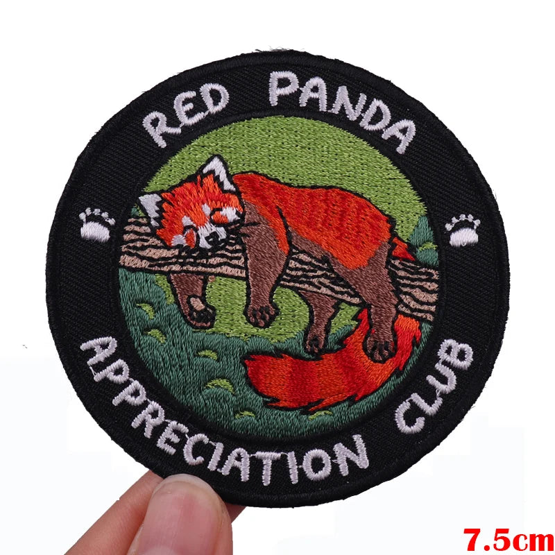 Red Panda appreciation club embroidered patch featuring a red panda illustration on a green background