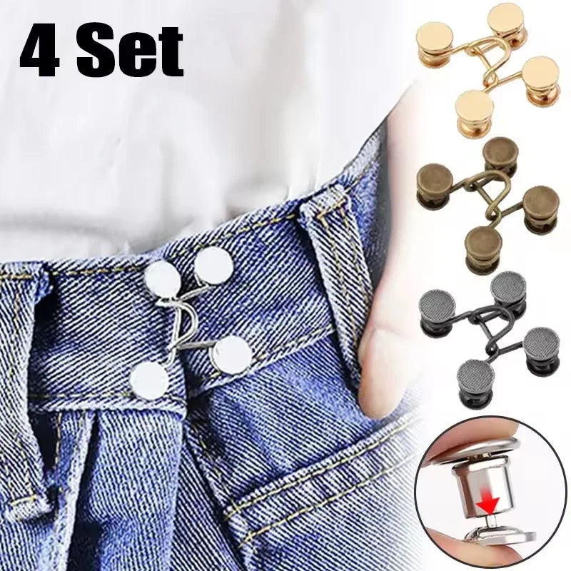 A set of four metal no-sew jeans buttons used for waist adjustments shown on denim fabric and a hand.