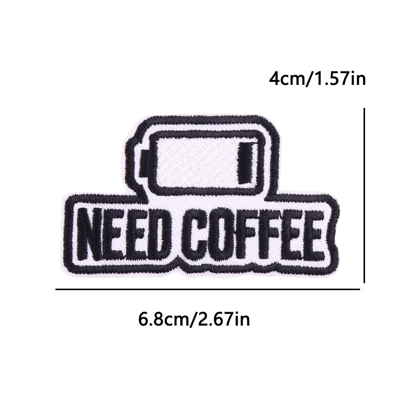 Black embroidered iron-on patch with the text NEED COFFEE on a light pink background.