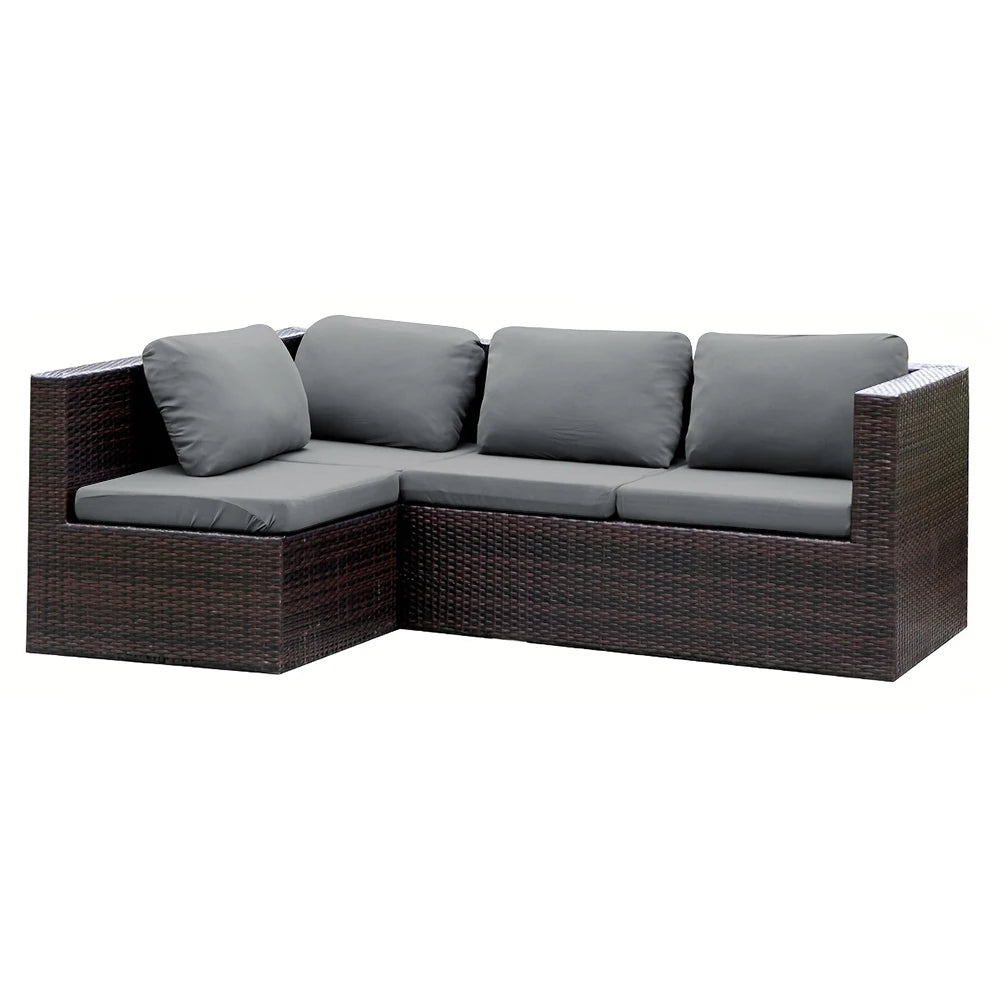 A grey stretch patio sofa cover set consisting of an outdoor sectional sofa and cushions made of brown wicker.
