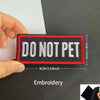 A black and red embroidered patch with the text DO NOT PET stitched onto a white background.