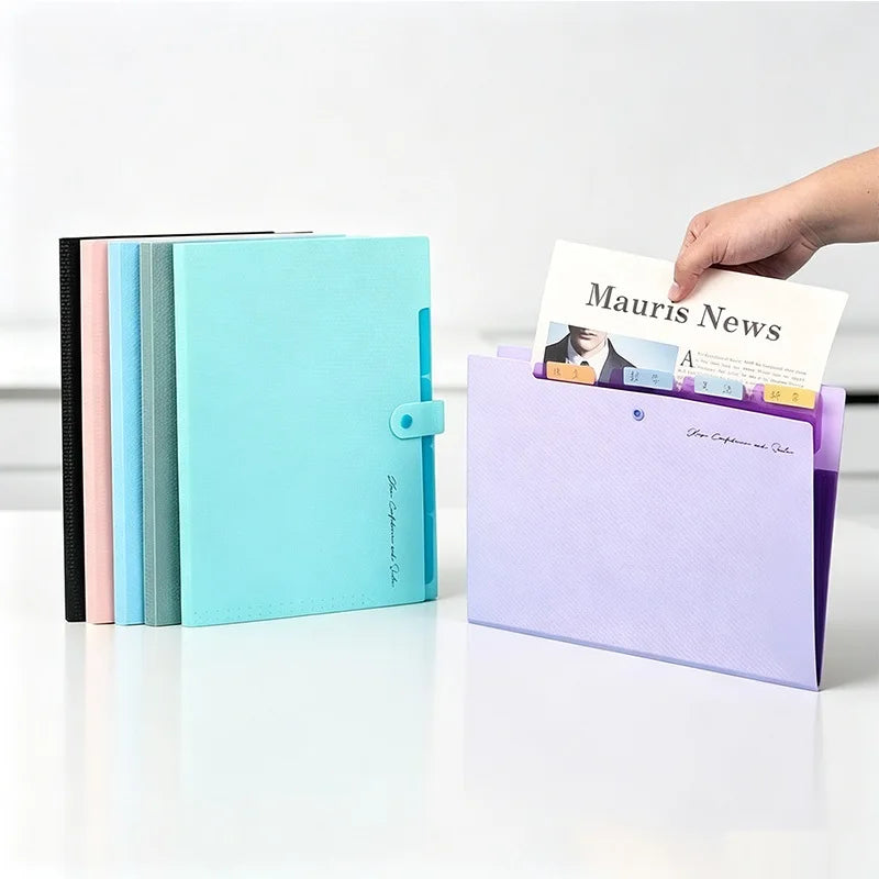 A hand is pulling a stack of colored accordion document folders from a purple folder, showing the interior pages.