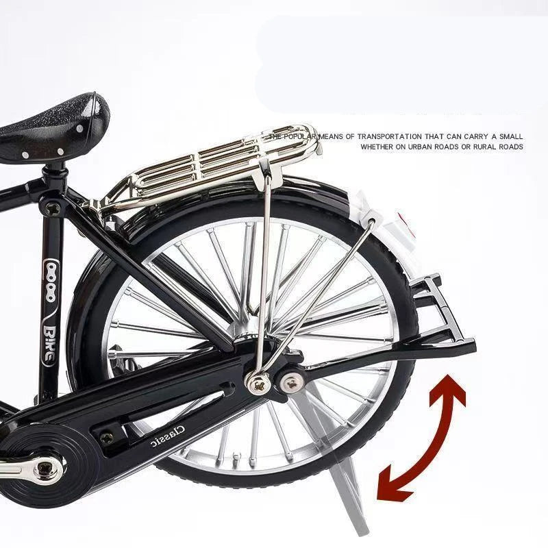 Schwarzes Retro-Fahrradmodell mit Drahtkorb und Speichenrädern, seitlich dargestellt.