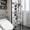 Black flower butterfly wall sticker applied to a glass shower door
