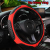 Red faux sheepskin steering wheel cover installed on a car interior.