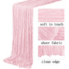 Pink semi-sheer gauze table runner with a clean edge and soft texture