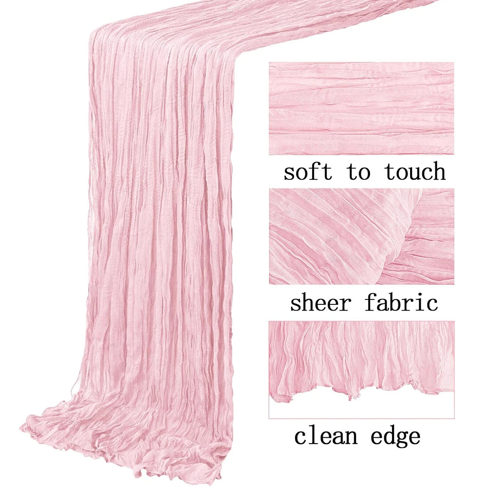 Pink semi-sheer gauze table runner with a clean edge and soft texture