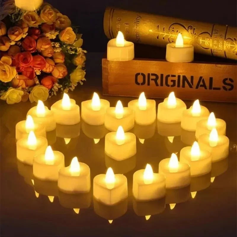 A collection of heart-shaped flameless LED candles arranged on a dark surface with a gold book in the background.