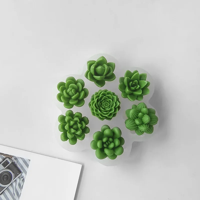 A set of green 3D succulent flower silicone molds for DIY crafts displayed on a white surface.