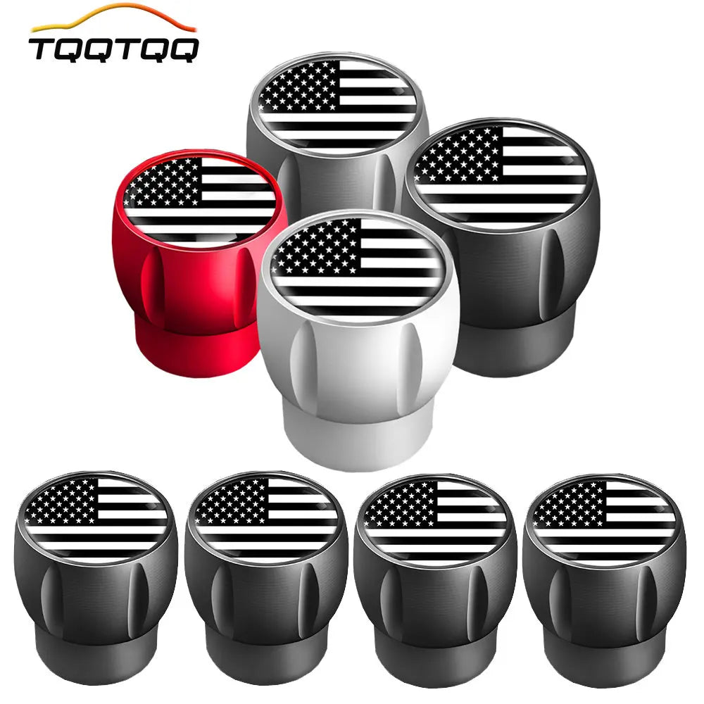 A set of four black tire valve caps featuring an American flag design.