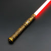 A golden hilt lightsaber with a red blade is shown against a dark gray background.
