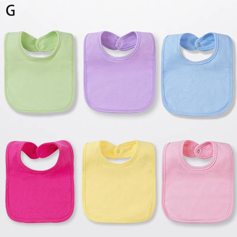 A set of six cotton bandana bibs in various colors including green, purple, blue, pink, and yellow.