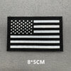 A black and white flag design featuring the American flag pattern with stars and stripes.