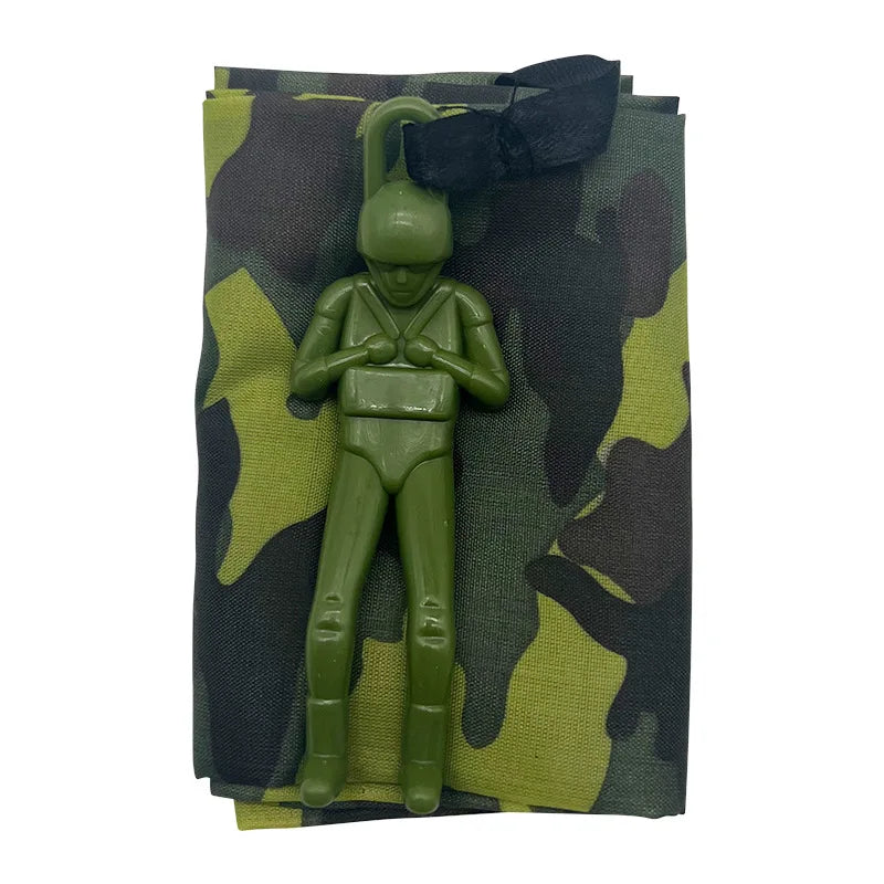 A hand-throw parachute toy featuring a mini soldier figure in olive green and camouflage fabric.