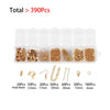 Clear plastic storage box containing various jewelry making components including clasps, jump rings, and crimps