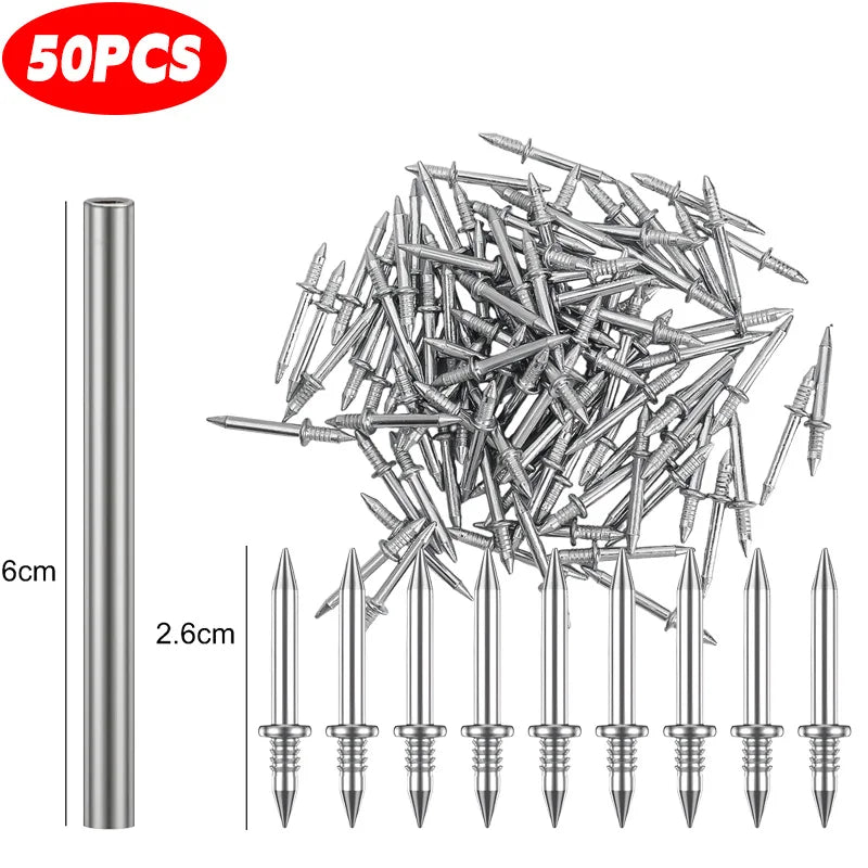 A collection of silver double head wood nails shown next to a measuring scale.
