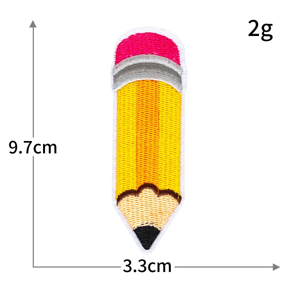 A yellow pencil iron-on patch with a pink tip and black tip, measuring 9.7cm long and 3.3cm wide.